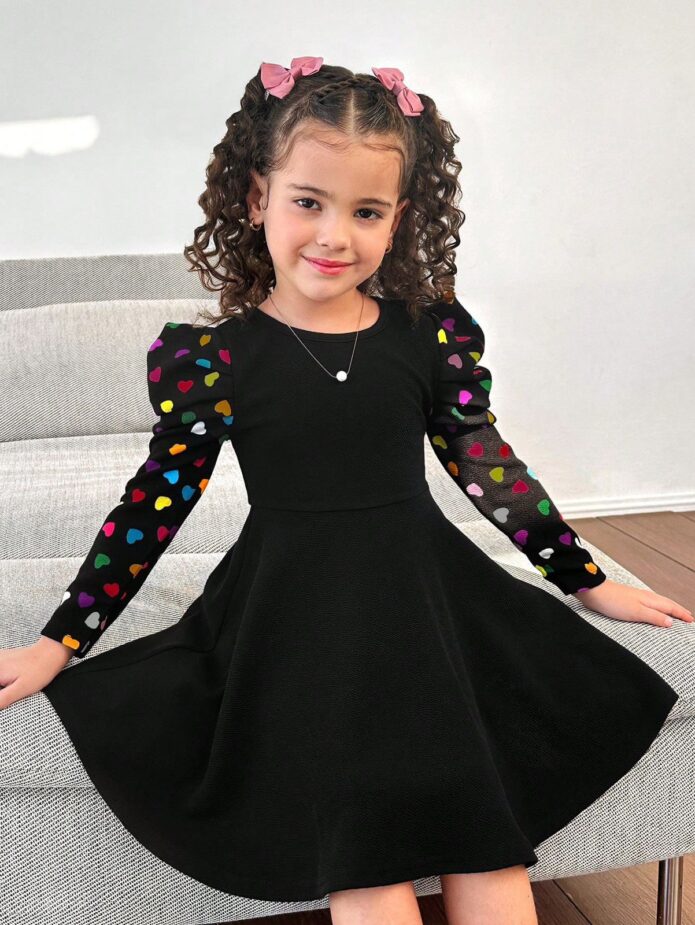 Vestido negro con mangas lunares multicolor